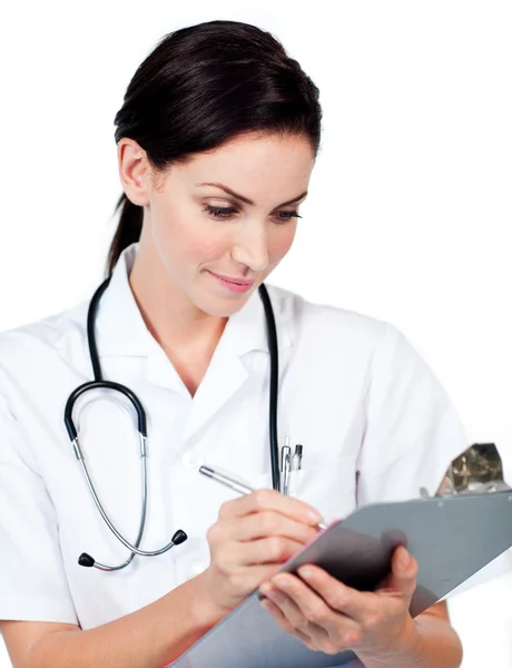 Medico donna fiducioso che scrive su un blocco a molla — Foto Stock