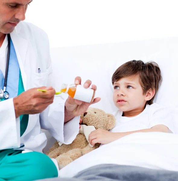 stock image Adorable little boy taking cough medicine