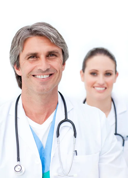 Positive doctors looking at the camera — Stock Photo, Image