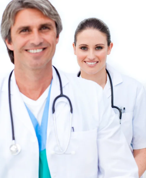 Two smiling doctors looking at the camera — Stock Photo, Image