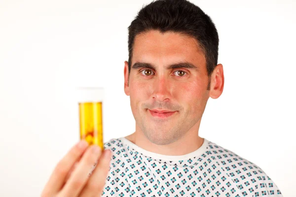 Paciente segurando pílulas e sorrindo — Fotografia de Stock