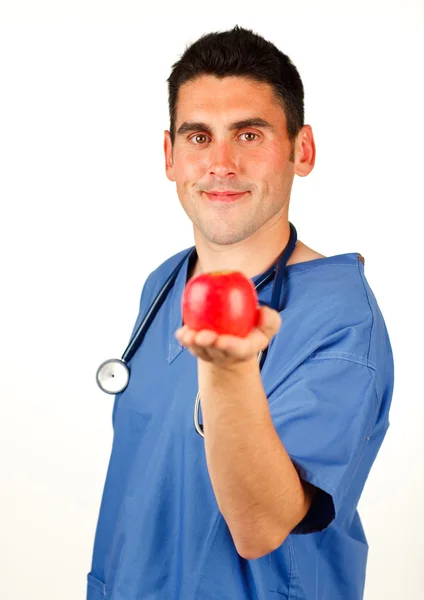Doktor ukazuje červené jablko — Stock fotografie