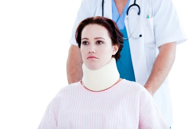 Portrait of an upset woman with a neck brace sitting on a wheelc — Stock Photo, Image