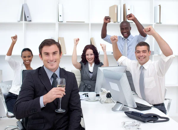 Happy businessteam celebrating a success in office — Stock Photo, Image