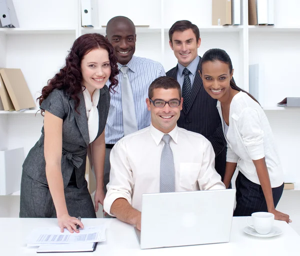 International businessteam using a laptop together — Stock Photo, Image
