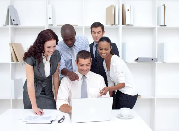 Business team working together with a laptop — Stock Photo, Image