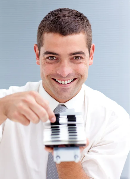 Attractive businessman consulting a directory — Stock Photo, Image