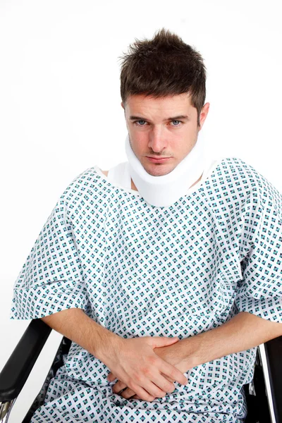 Man with a neck brace in hospital — Stock Photo, Image