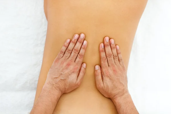 Close-up of hands giving massage — Stock Photo, Image