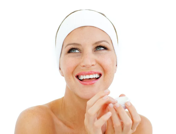 Laughing woman holding a lip balm — Stock Photo, Image