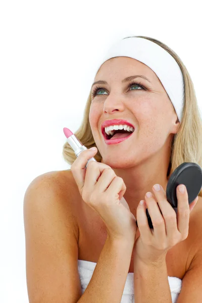 Delighted woman holding a lipstick — Stock Photo, Image