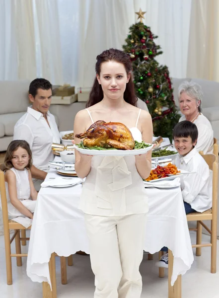 Mother showing turkey for Christmas dinner — Stock Photo, Image