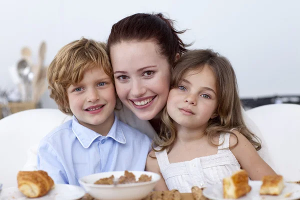 Children and mother having breakfast — Stock Photo, Image