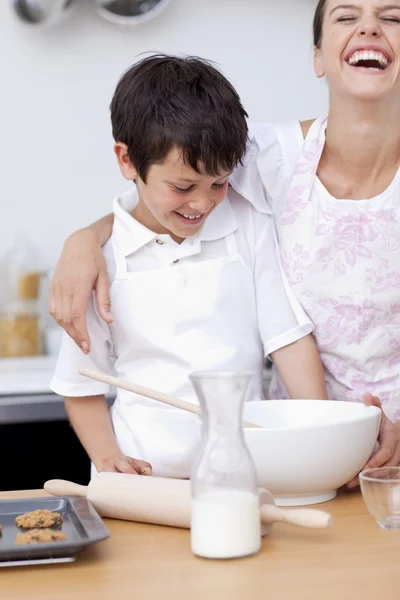Mother and son laughing in the kitchen — Stock Photo, Image
