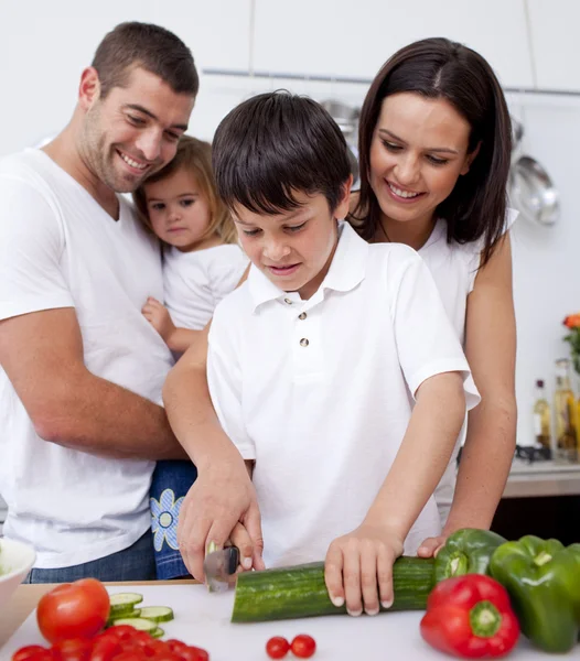 Son preparing food with his family — Stock Photo, Image