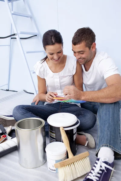 stock image Couple with colour samples to paint new house