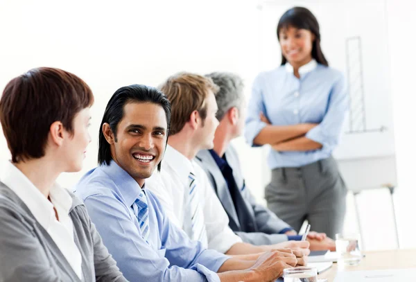 Charming businessman looking at the camera in a meeting — Stock Photo, Image