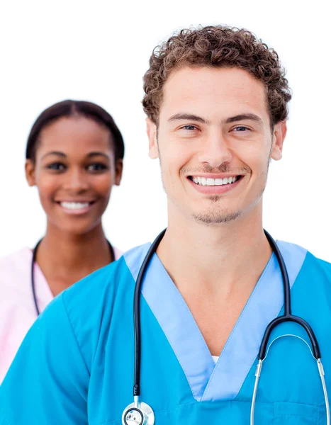 Очаровательные врачи улыбаются в камеру Стоковое Фото