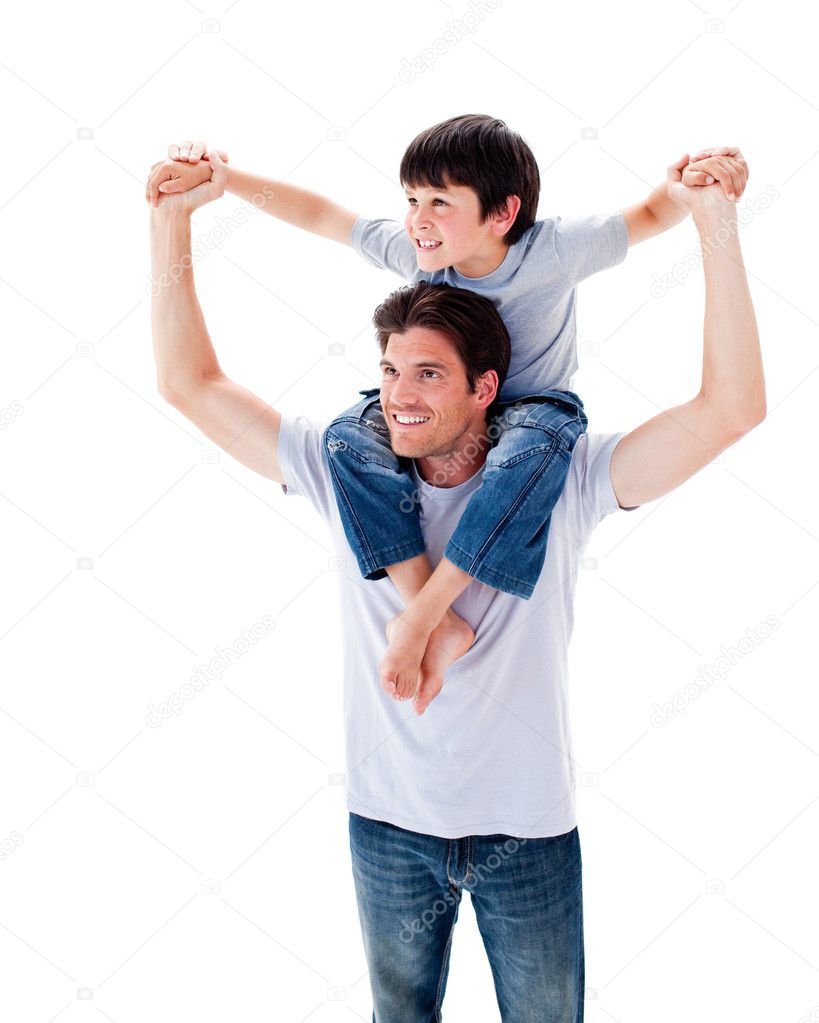 Man giving boy piggyback ride Man giving boy piggy back ride against white  background, model