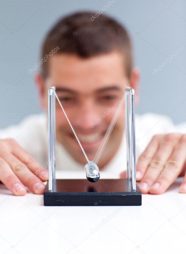 Businessman looking at pendulum balls — Stock Photo © Wavebreakmedia ...