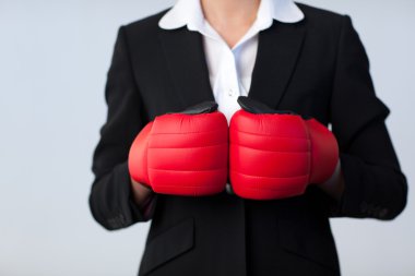 Business woman with boxing gloves on clipart
