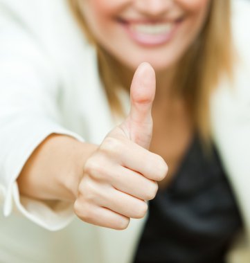 Businesswoman with her thumbs up clipart