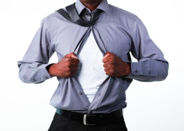 Portrait of a businessman showing tshirt under his suit clipart