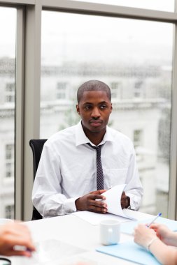 Afro-American businessman in a meeting clipart