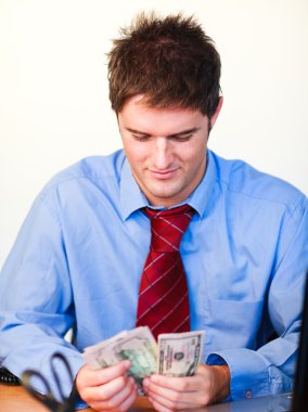 Businessman counting money clipart