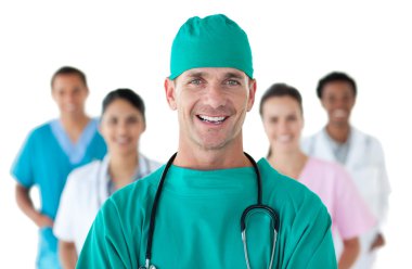 Smiling surgeon in front of his team clipart