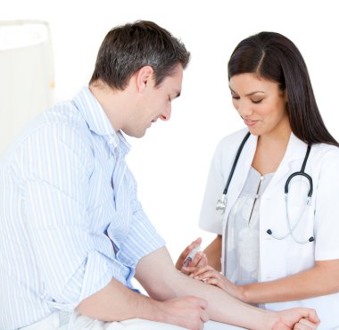 Radiant female doctor making injection to her patient clipart