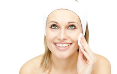 Beautiful woman putting foundation cream clipart