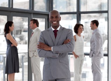 Afro-american male leader with his team clipart