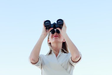 Businesswoman looking through binoculars clipart