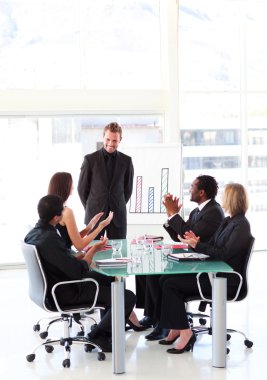 Business clapping a colleague in a presentation clipart