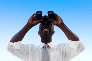 Businessman looking through binoculars clipart