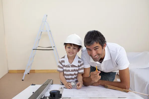 Father and son refurbishing a bedroom — Stock Photo, Image