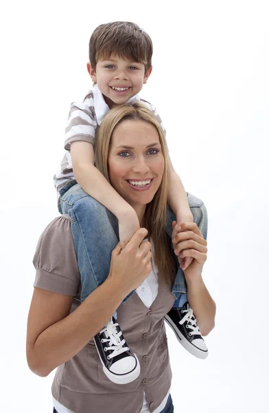 Mother giving son piggyback ride — Stock Photo, Image