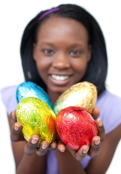 stock image Happy ethnic woman showing Easter eggs