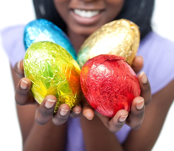 stock image Close-up of a woman showing colorful Easter eggs