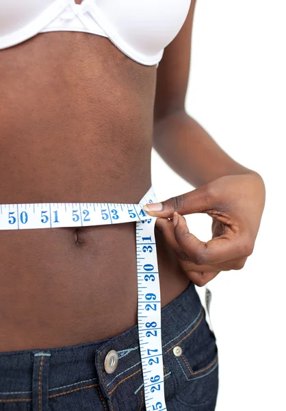 stock image Ethnic woman measuring her waist with a tape measure