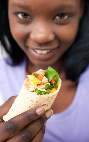 stock image Attractive Afro-american woman eating a wrap