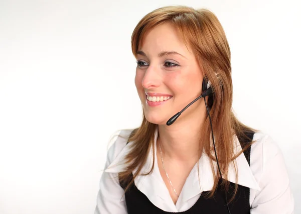 Vrouw op een hoofdtelefoon te praten — Stockfoto