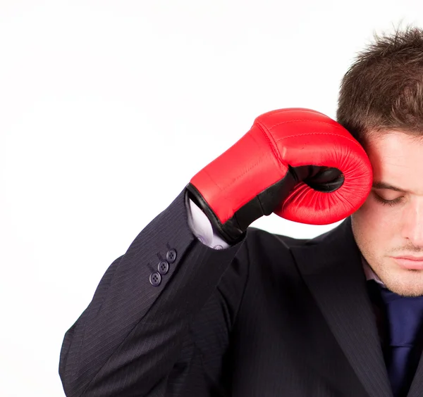 Businessman with boxing gloves to his head — Stock Photo, Image