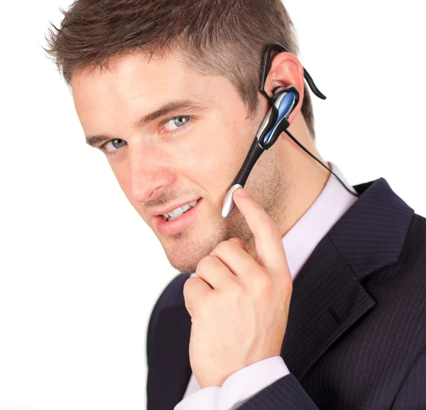 Uomo d'affari che parla con un auricolare — Foto Stock