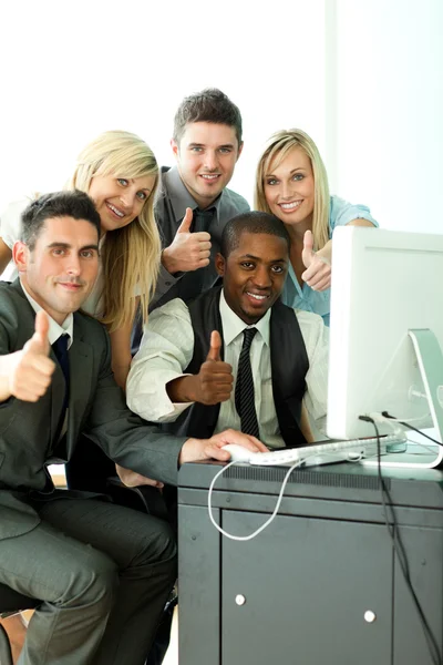 International business team wth thumbs up in office — Stock Photo, Image