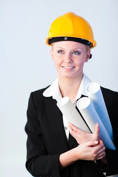 Female constrcution worker with blueprints — Stock Photo, Image