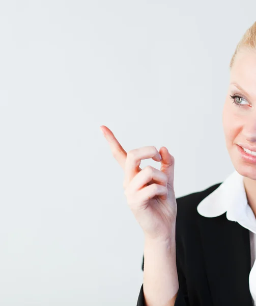 Businesswoman pointing to the side — Stock Photo, Image