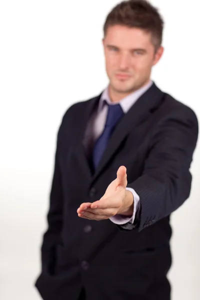Бізнесмен, який показує рукостискання до камери — стокове фото