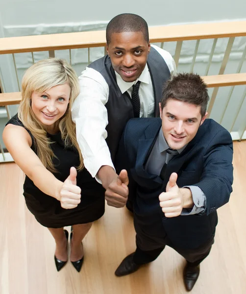 Business on stairs with thumbs up — Stock Photo, Image